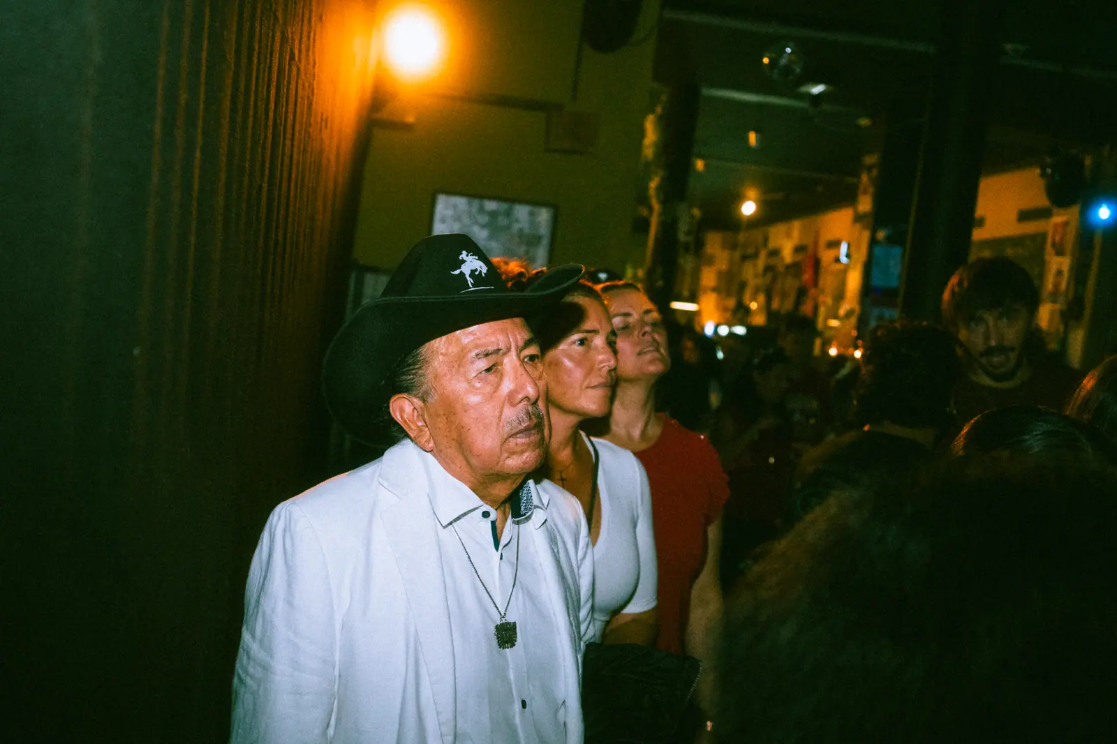 Event photography Zürich — portrait of a guest in a crowded bar